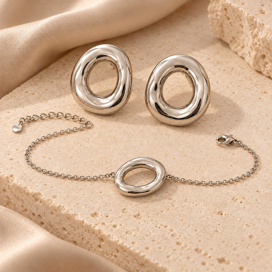 Conjunto plateado de pendientes y pulsera ovalados – Acero inoxidable