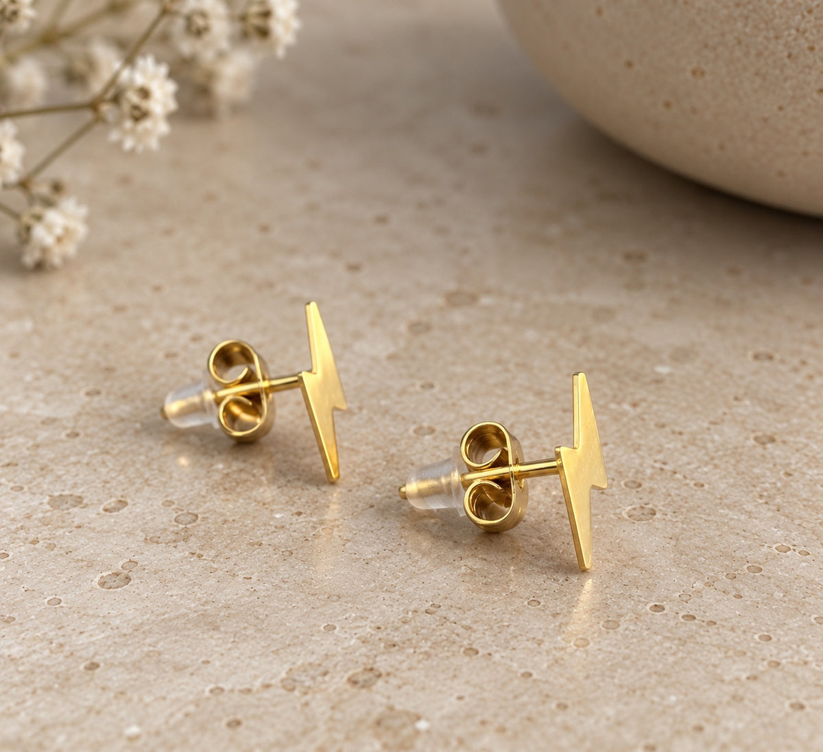 Pendientes rayos dorados vista lateral